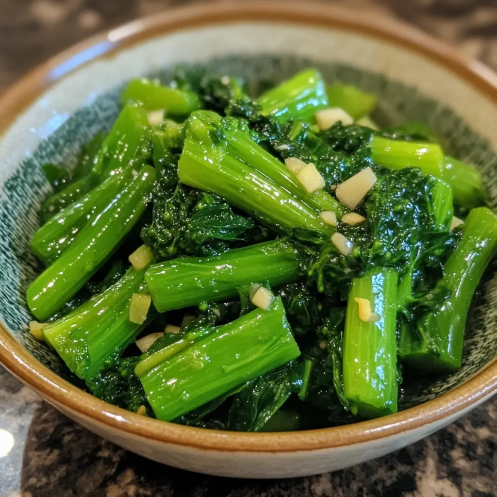4.0 cups Chinese broccoli chopped, 1.0 tbsp vegetable oil, 3.0 cloves garlic minced, 0.5 tsp salt